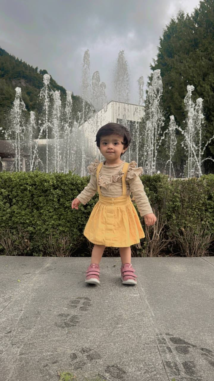 Stylish dungaree skirt paired with a cute ruffle top - www.styletriggers.com