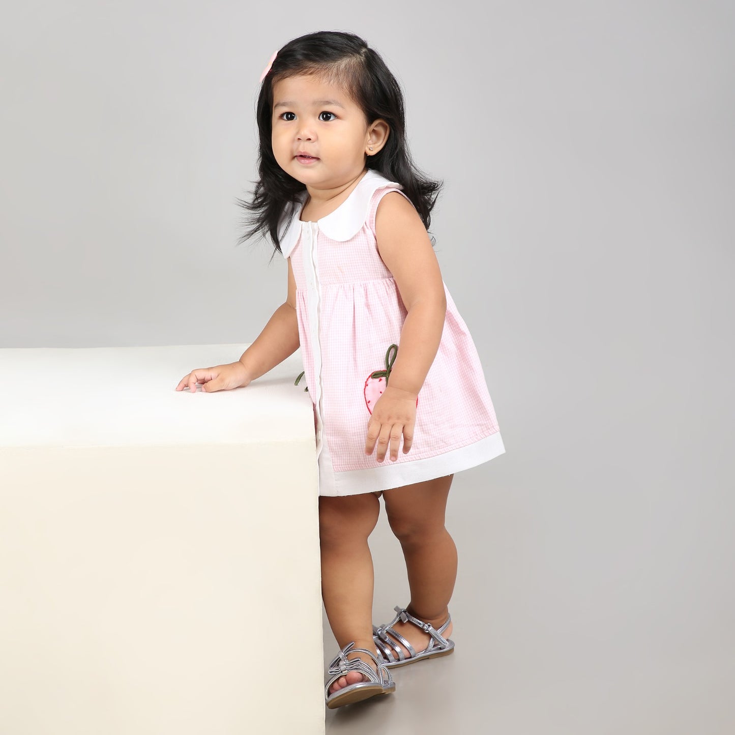 Adorable light pink A-line dress with white accents and cute strawberry embroidery