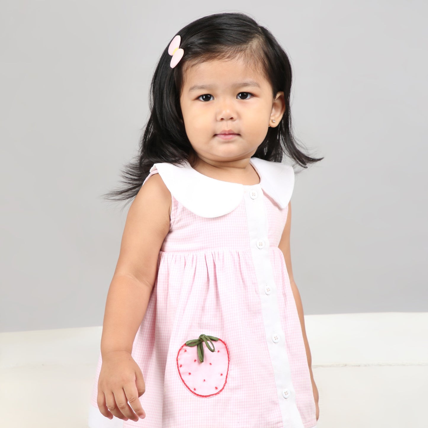 Adorable light pink A-line dress with white accents and cute strawberry embroidery