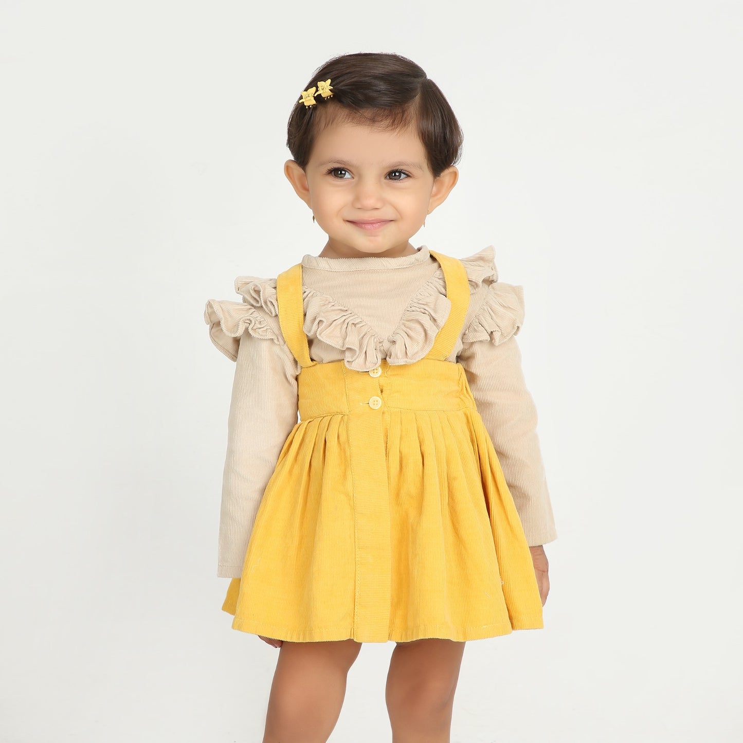 Stylish dungaree skirt paired with a cute ruffle top