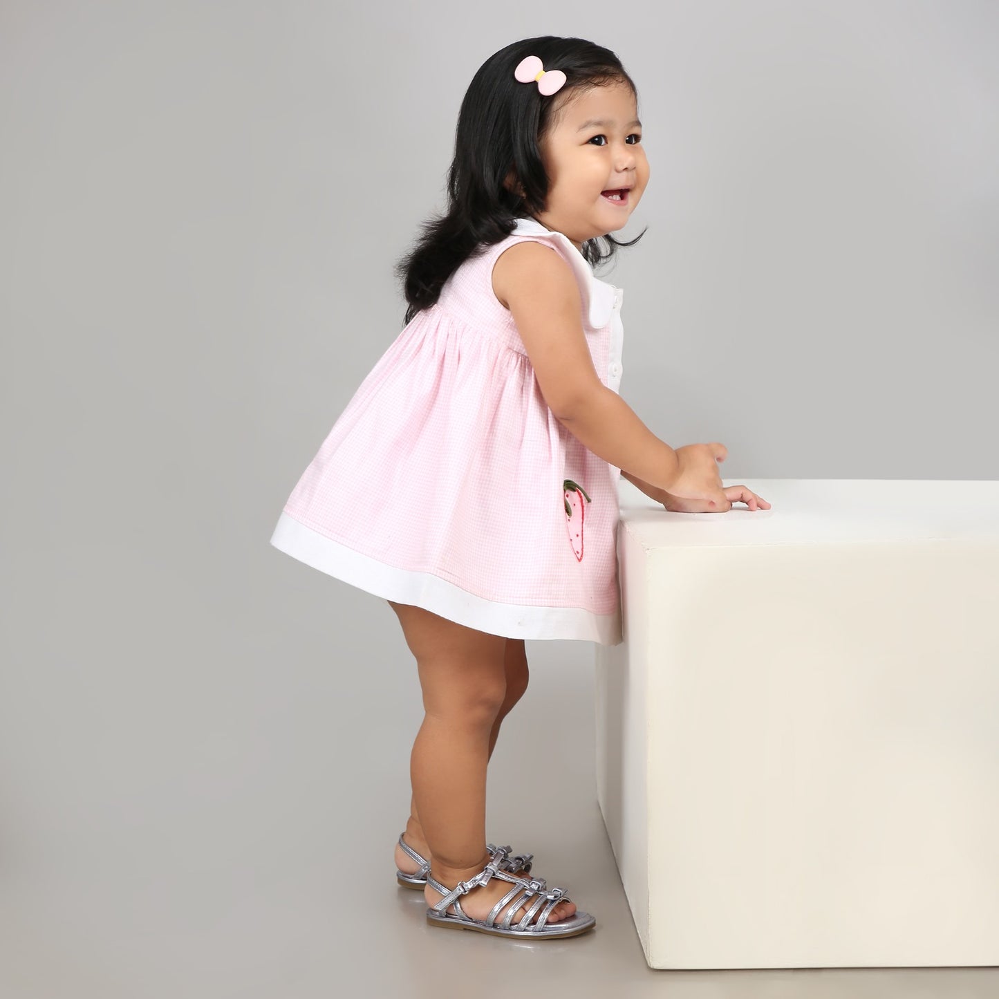 Adorable light pink A-line dress with white accents and cute strawberry embroidery