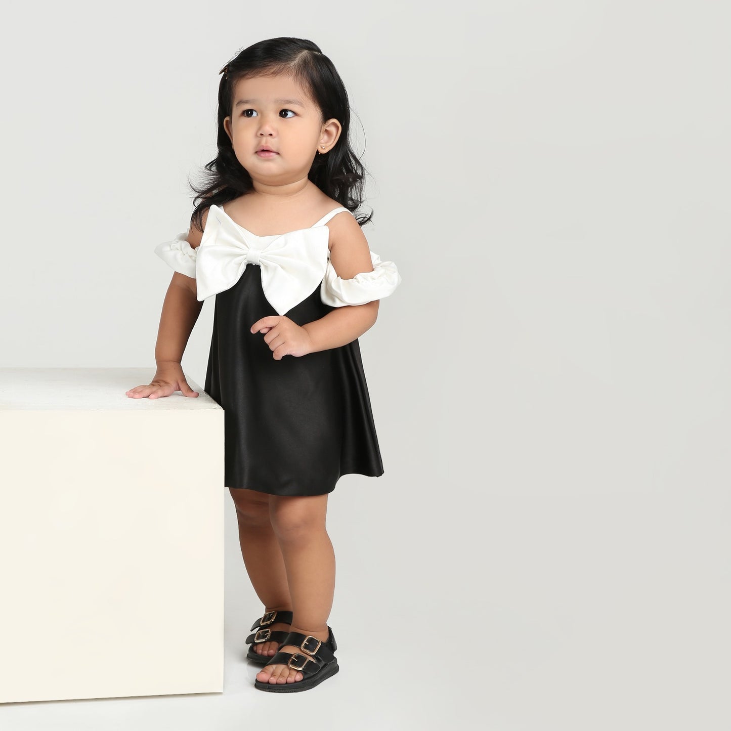 Elegant black party dress for girls with stylish white bow and sleeves