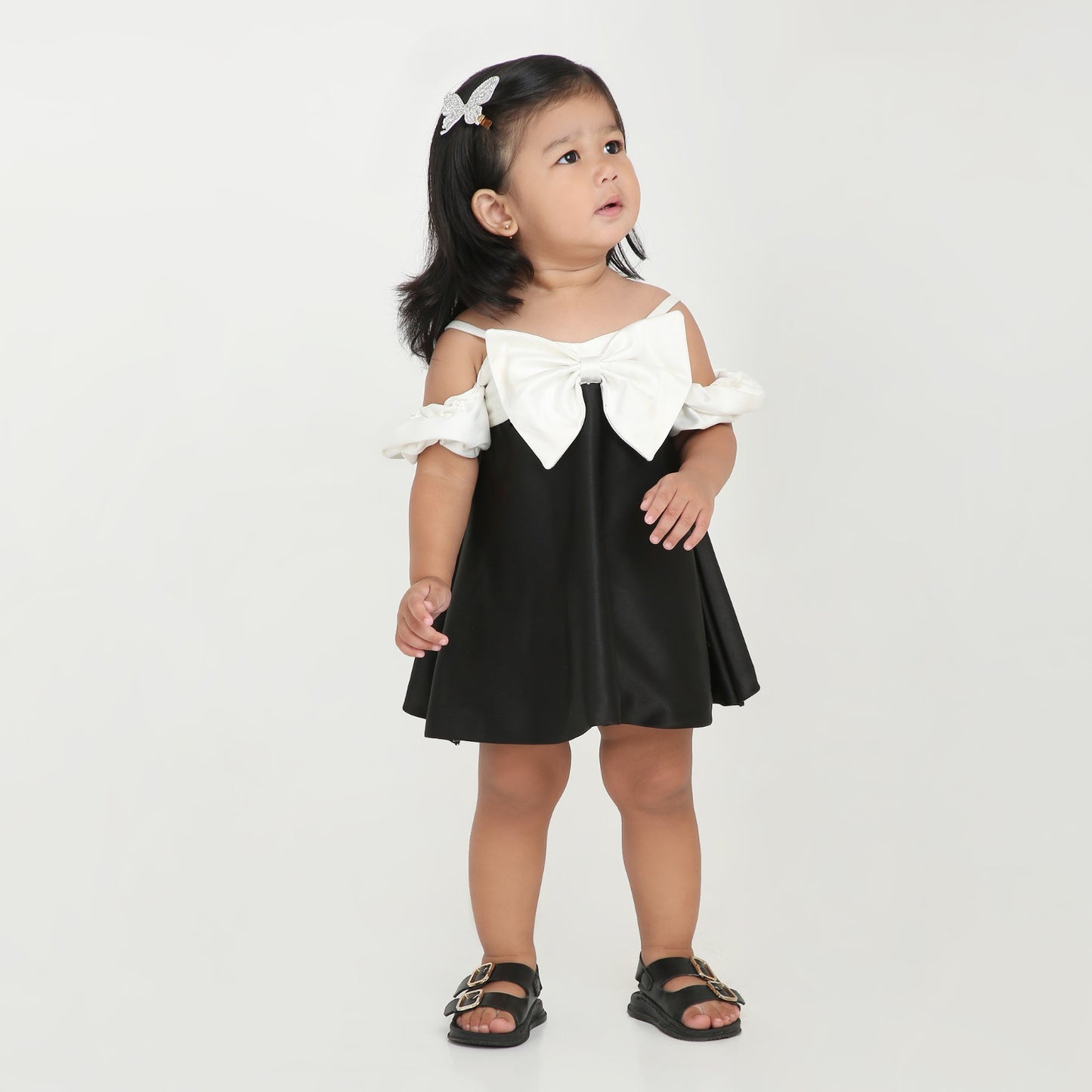 Elegant black party dress for girls with stylish white bow and sleeves
